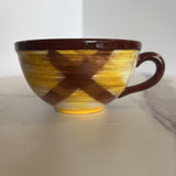 brown and yellow plaid mug