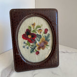 leather frame with floral cross stitch