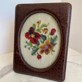 leather frame with floral cross stitch