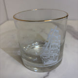 glass with white ship