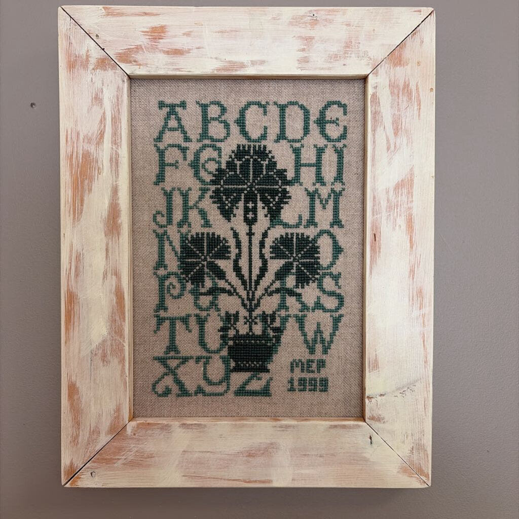 framed green alphabet sampler