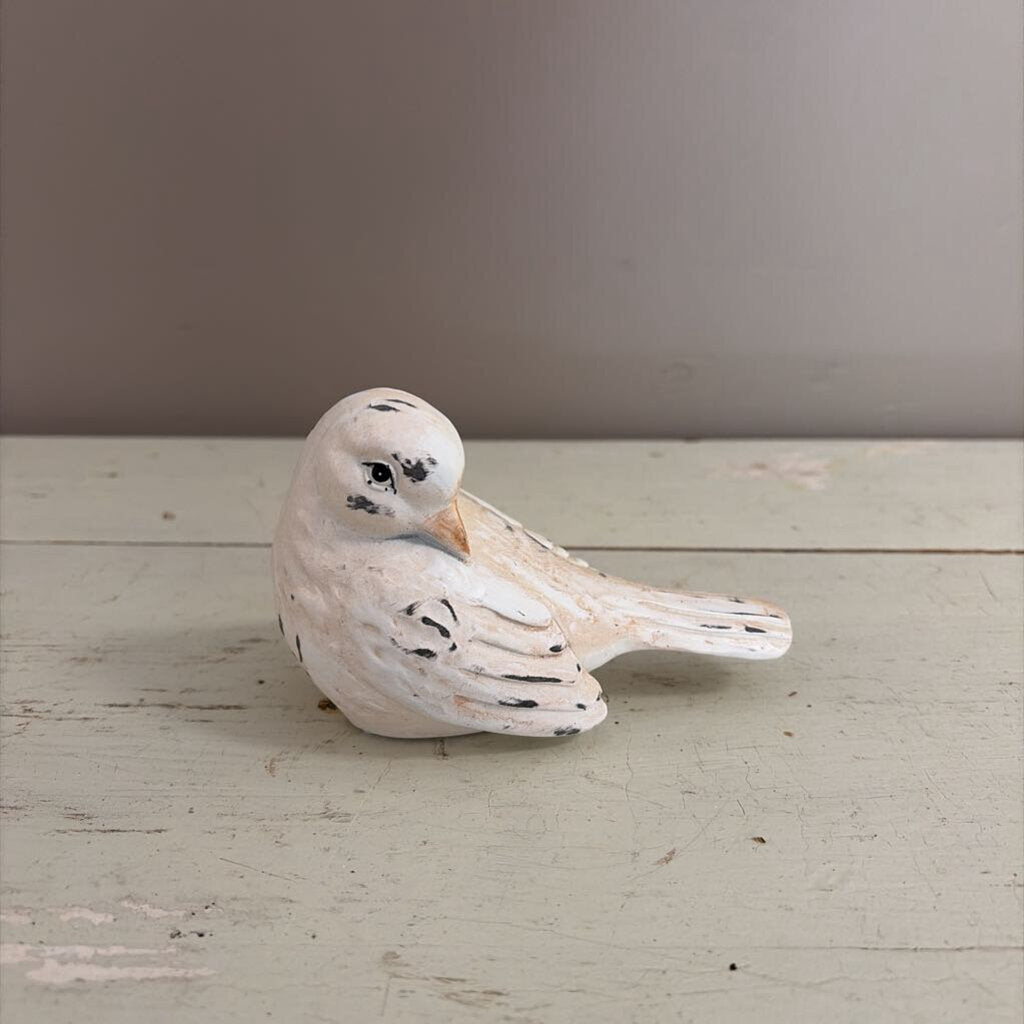 white bird figurine