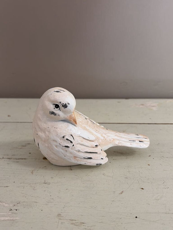 white bird figurine