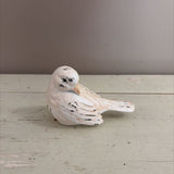 white bird figurine