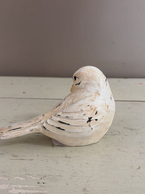 white bird figurine