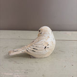 white bird figurine