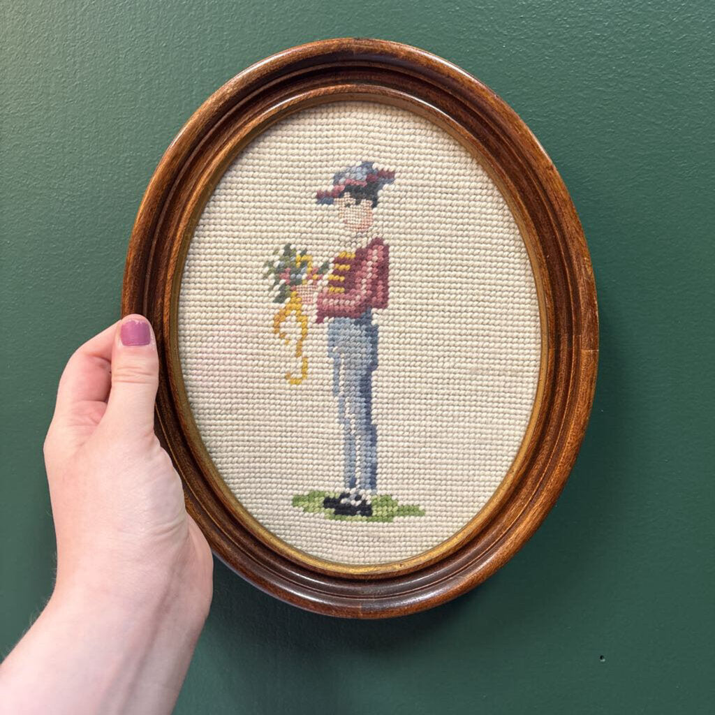 Man Holding Flowers Framed Oval Needlepoint