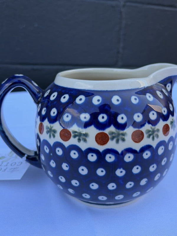 Polish pottery pitcher with sprig pattern