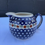Polish pottery pitcher with sprig pattern