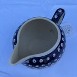Polish pottery pitcher with sprig pattern