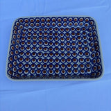 blue and brown pattern Polish pottery dish