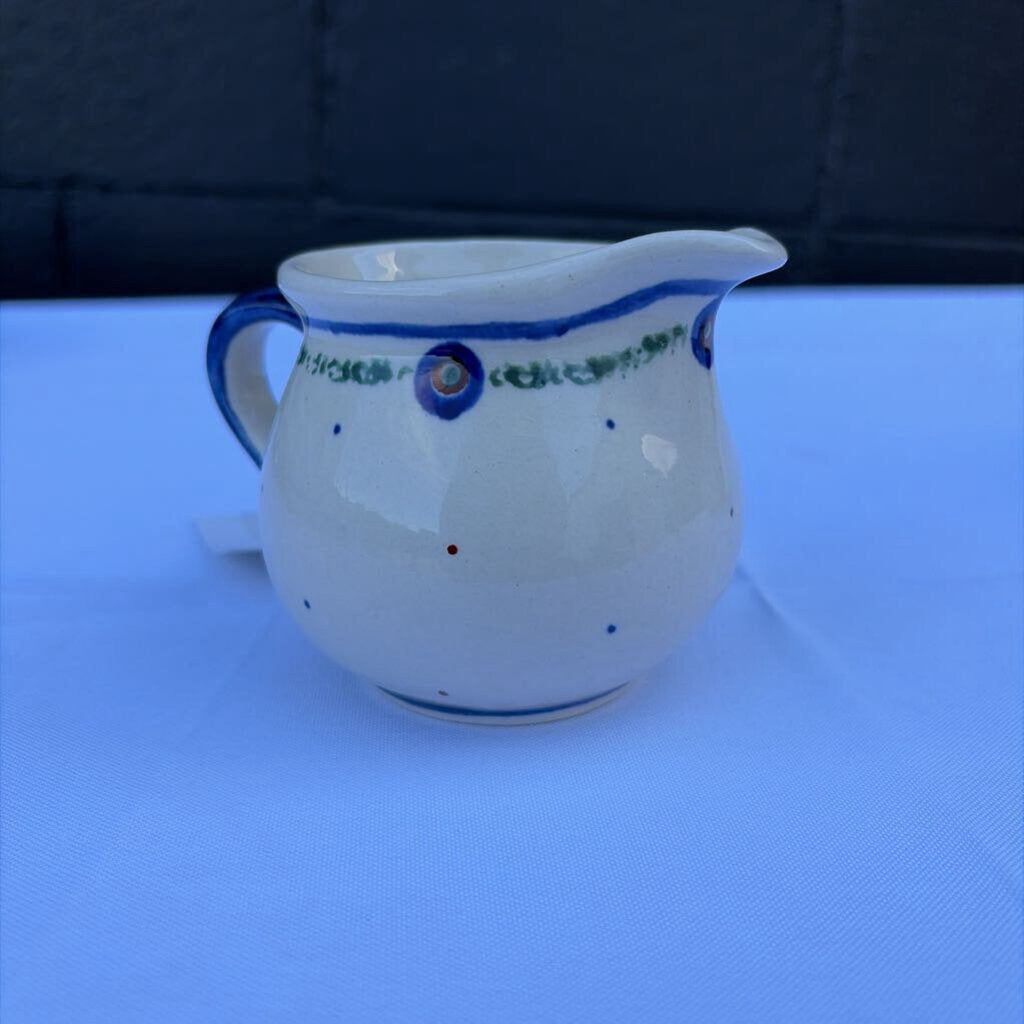 Polish pottery creamer with small dot pattern