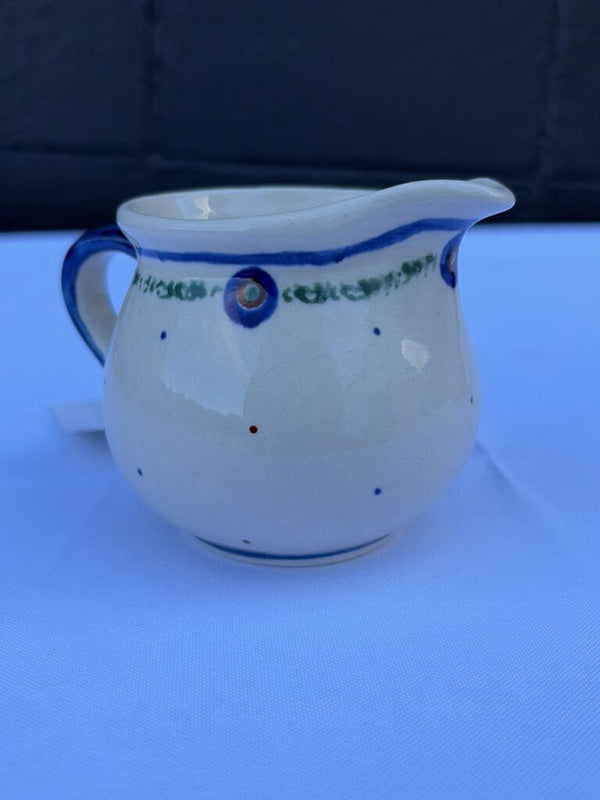 Polish pottery creamer with small dot pattern