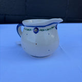 Polish pottery creamer with small dot pattern