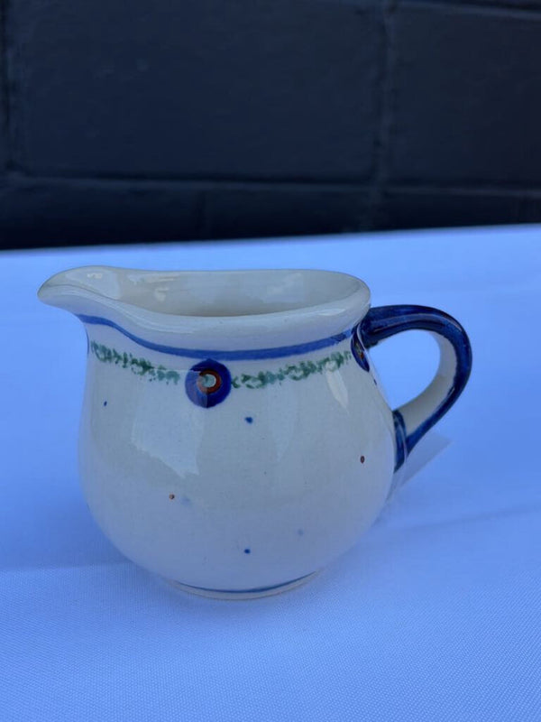 Polish pottery creamer with small dot pattern