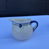 Polish pottery creamer with small dot pattern