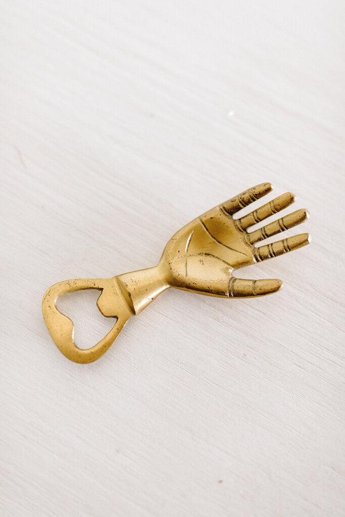 brass hand bottle opener