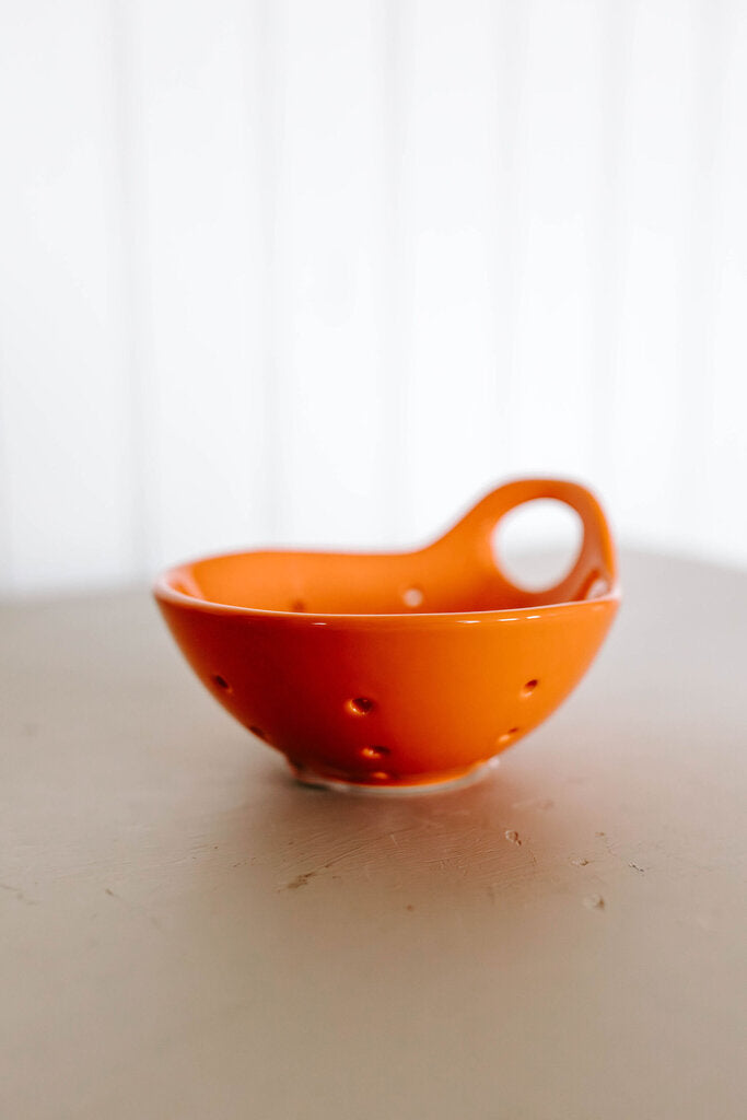 orange stoneware berry bowl
