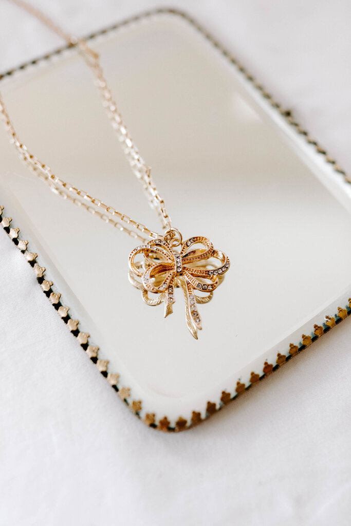 bow pendant necklace in gold